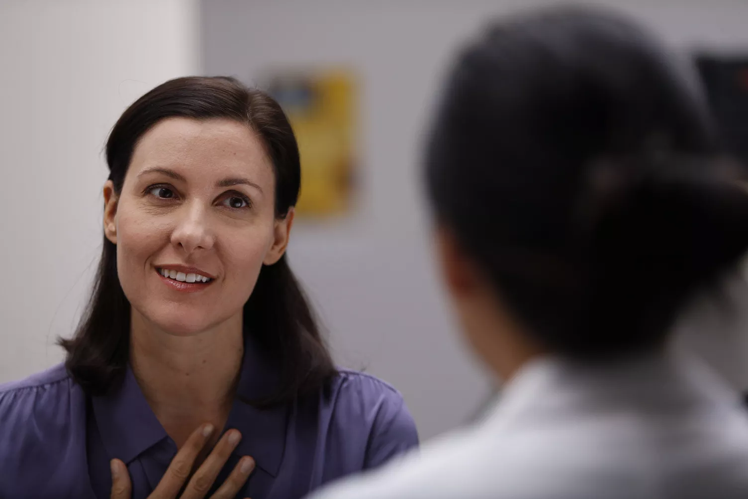 Woman talking to healthcare professional