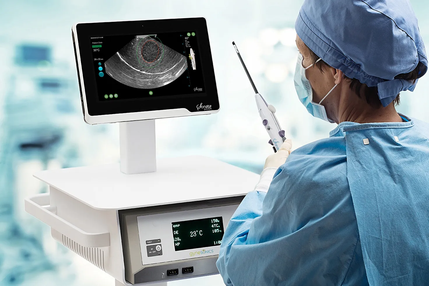 Person in OR with Sonata handpiece; ultrasound on monitor.