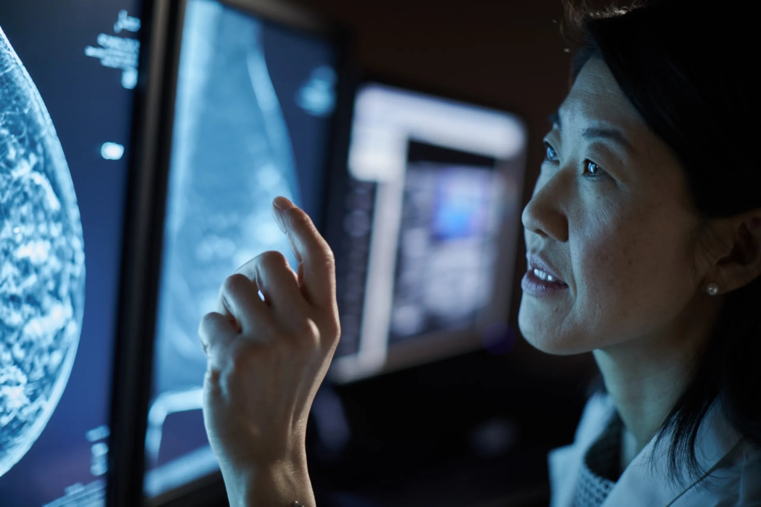 A radiologist looking at a breast scan