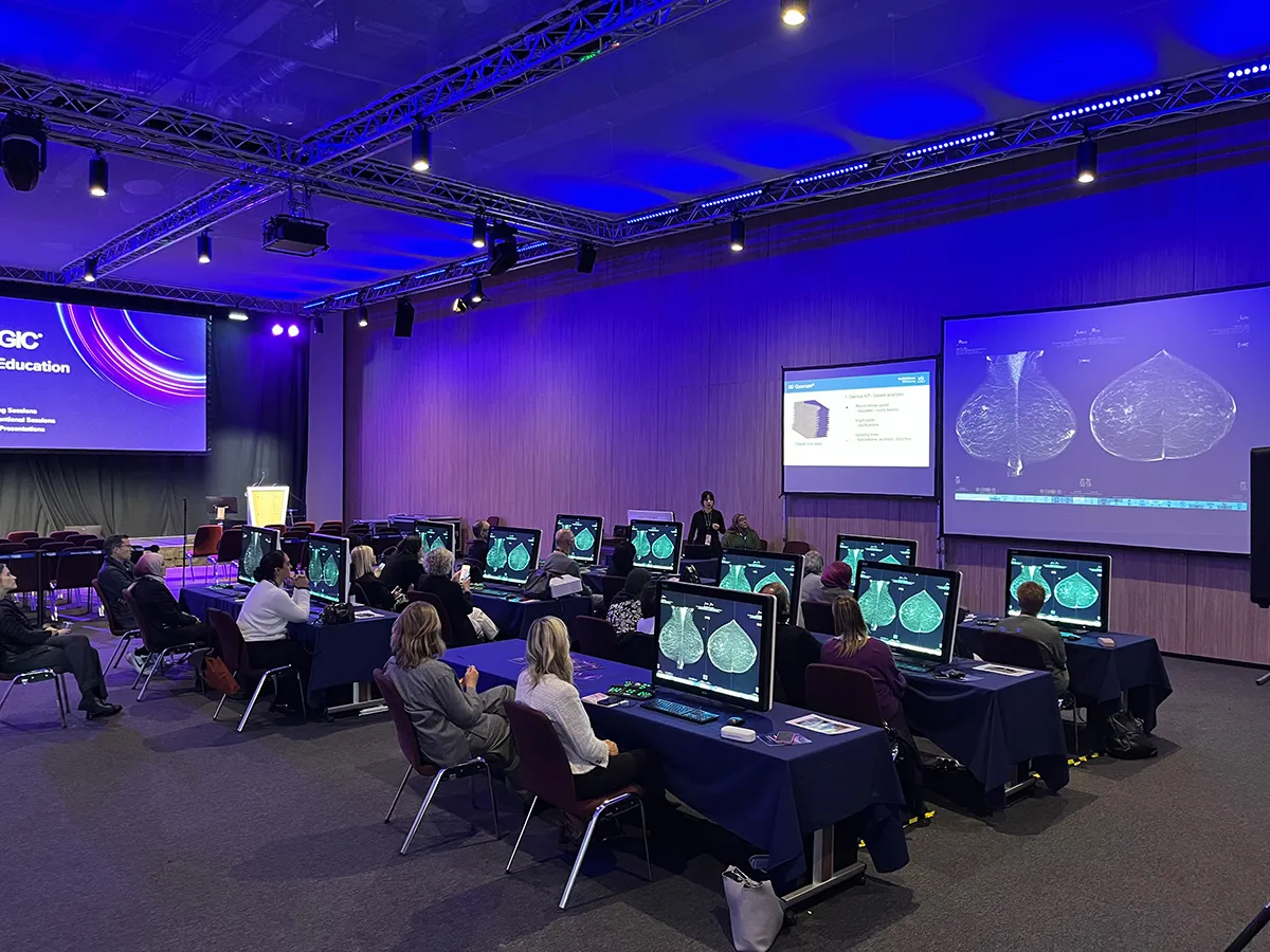 Medical education workshop from EUOBI showing delegates and screens.