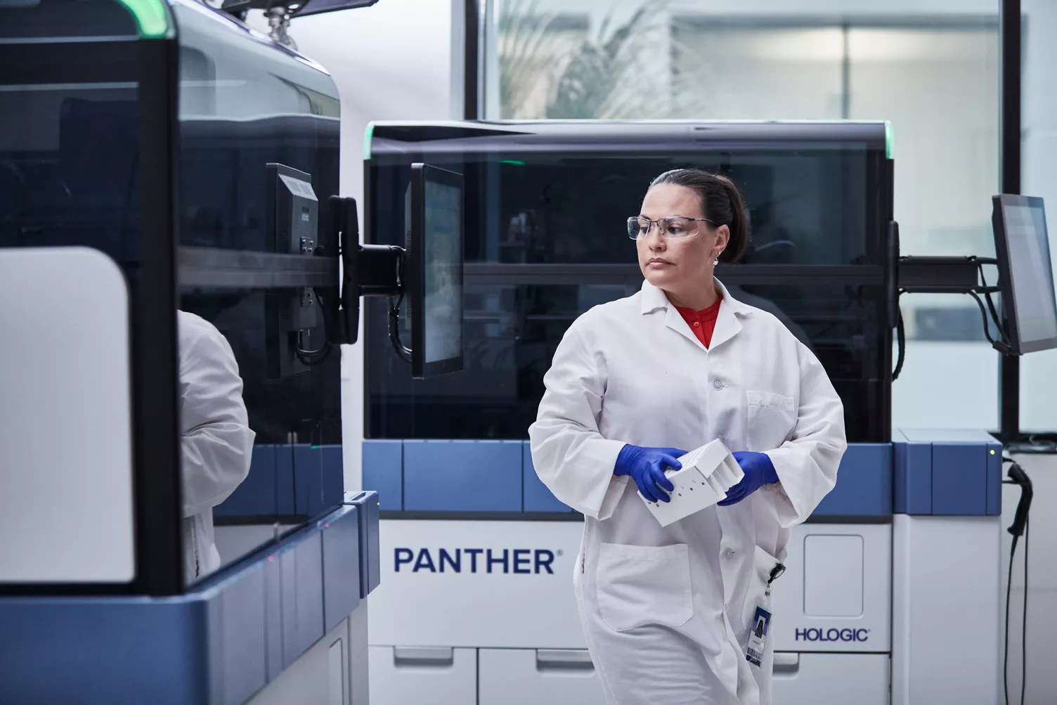 Technician walking through lab.