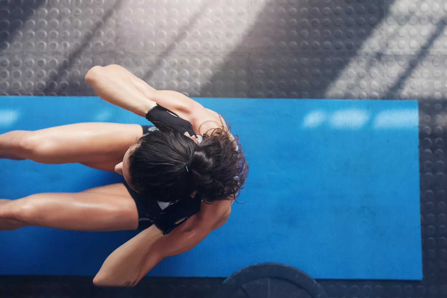 Woman working out on the yoga mat