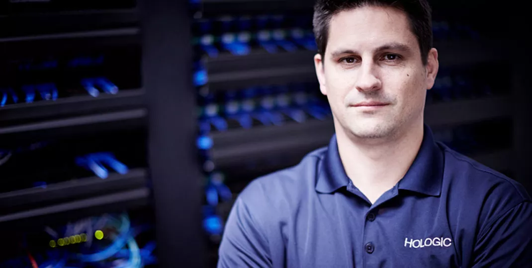 Hologic staff standing in front of server room