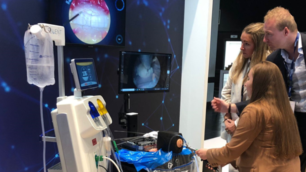 Group of people looking at medical images on a screen